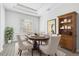 Elegant dining room with wood floors and a charming buffet at 854 Macewen Dr, Osprey, FL 34229