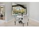 Bright breakfast nook with marble table and chairs, overlooks the pool at 854 Macewen Dr, Osprey, FL 34229