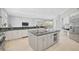 Bright kitchen featuring a large island and granite countertops at 854 Macewen Dr, Osprey, FL 34229