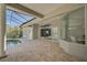 Spacious covered patio overlooks refreshing pool with fire pit and ample seating at 854 Macewen Dr, Osprey, FL 34229