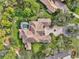 Bird's-eye view of a large home with tile roof and circular driveway at 854 Macewen Dr, Osprey, FL 34229