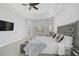 Bright main bedroom with a large bed, plenty of natural light, and a ceiling fan at 854 Macewen Dr, Osprey, FL 34229