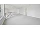 Large bedroom with grey carpet, and multiple doors to closets and bathrooms at 854 Macewen Dr, Osprey, FL 34229