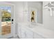 Modern bathroom with white quartz countertop, and a view of the pool at 854 Macewen Dr, Osprey, FL 34229