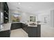 Dark wood kitchen cabinets and granite countertops at 854 Macewen Dr, Osprey, FL 34229