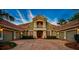 Grand two-story home with three-car garage and lush landscaping at 854 Macewen Dr, Osprey, FL 34229