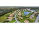 Aerial view of a residential neighborhood with houses and a lake at 409 147Th Ne Ct, Bradenton, FL 34212