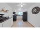 Clean and functional kitchen with white cabinets and black appliances at 1105 58Th S St, Gulfport, FL 33707