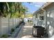 Side yard with brick pavers, shed, and privacy fence at 1105 58Th S St, Gulfport, FL 33707