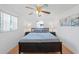Spacious bedroom with a king-size bed and wood floors at 1105 58Th S St, Gulfport, FL 33707