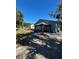 Backyard with a covered patio area, a storage shed, and grassy area at 1105 58Th S St, Gulfport, FL 33707