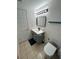 Modern bathroom featuring a gray vanity, white sink, and sleek fixtures at 1105 58Th S St, Gulfport, FL 33707