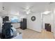 Efficient kitchen with white cabinets, black appliances, and tiled floors at 1105 58Th S St, Gulfport, FL 33707