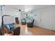 Living room with hardwood floors, ceiling fan, and large window at 1105 58Th S St, Gulfport, FL 33707