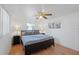 Main bedroom with king-size bed and wood floors at 1105 58Th S St, Gulfport, FL 33707