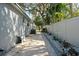 Paved walkway and white fence in the side yard at 1105 58Th S St, Gulfport, FL 33707