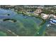 Aerial view of waterfront property with community pool and boat slips at 14021 Bellagio Way # 201, Osprey, FL 34229