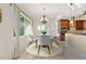 Bright dining area with round table and four chairs, situated next to a kitchen at 1900 Colleen St, Sarasota, FL 34231