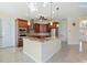 L-shaped kitchen island with granite countertops and stainless steel appliances at 1900 Colleen St, Sarasota, FL 34231