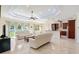 Modern kitchen with granite countertops, stainless steel appliances, and custom cabinetry at 1900 Colleen St, Sarasota, FL 34231