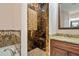 Walk-in shower with marble tile and built-in seat at 1900 Colleen St, Sarasota, FL 34231