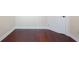 Basement with hardwood floors and white baseboards at 1900 Colleen St, Sarasota, FL 34231