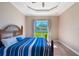 Bedroom with hardwood floors, natural light, and view of the backyard at 1900 Colleen St, Sarasota, FL 34231