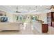 Open living room and kitchen with modern fixtures and flooring at 1900 Colleen St, Sarasota, FL 34231