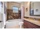 Bathroom with granite vanity and marble shower/tub combo at 1900 Colleen St, Sarasota, FL 34231