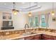 Kitchen featuring modern countertops, sink, stainless steel appliances, and view of the backyard at 1900 Colleen St, Sarasota, FL 34231
