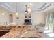 Open-concept kitchen featuring granite countertops, stainless steel sink, and modern recessed lighting at 1900 Colleen St, Sarasota, FL 34231