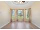 Bright living room boasting large windows with backyard views and neutral colored walls at 1900 Colleen St, Sarasota, FL 34231