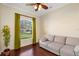 Bright living room featuring hardwood floors, large window, and comfortable sofa at 1900 Colleen St, Sarasota, FL 34231