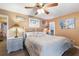 Second bedroom with a king-size bed and ensuite bathroom at 2105 Riverview Blvd, Bradenton, FL 34205