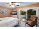 Main bedroom with a king-size bed and private balcony access at 2105 Riverview Blvd, Bradenton, FL 34205