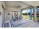 Covered patio with seating area and ceiling fan at 29205 Saddlebag Trl, Myakka City, FL 34251