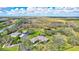 Aerial view of home with pool and expansive lot at 29205 Saddlebag Trl, Myakka City, FL 34251