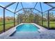 Enjoy this refreshing screened pool with a spacious deck at 29205 Saddlebag Trl, Myakka City, FL 34251