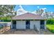 Three-stall barn with individual gated enclosures at 29205 Saddlebag Trl, Myakka City, FL 34251