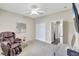Serene bedroom with a massage chair and large closet at 29205 Saddlebag Trl, Myakka City, FL 34251