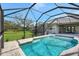 Large refreshing screened pool with a spacious deck at 29205 Saddlebag Trl, Myakka City, FL 34251