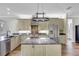 Large kitchen with granite island, stainless steel appliances, and custom cabinetry at 29205 Saddlebag Trl, Myakka City, FL 34251