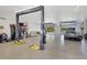 Spacious garage with car lift and storage at 29205 Saddlebag Trl, Myakka City, FL 34251