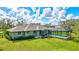 Home's backyard features a pool and screened enclosure, perfect for relaxation at 29205 Saddlebag Trl, Myakka City, FL 34251