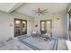 Relaxing covered patio with seating area and ceiling fan at 29205 Saddlebag Trl, Myakka City, FL 34251