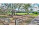 Pasture with mature trees and gated entrance at 29205 Saddlebag Trl, Myakka City, FL 34251