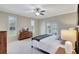 Spacious bedroom with plush bedding and access to a private patio at 29205 Saddlebag Trl, Myakka City, FL 34251
