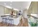 Spacious kitchen with granite countertops, stainless steel appliances, and an island at 29205 Saddlebag Trl, Myakka City, FL 34251