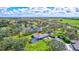 Aerial view showing home, pool, and expansive pasture at 29205 Saddlebag Trl, Myakka City, FL 34251