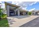 Spacious three-car garage with RV parking and workshop area at 29205 Saddlebag Trl, Myakka City, FL 34251